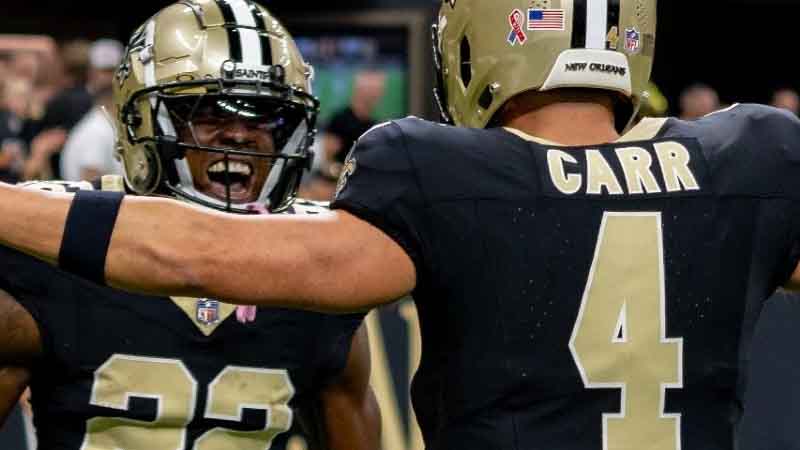 Derek Carr celebrating with teammates